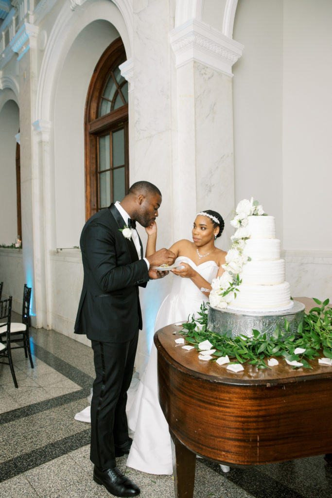 Renee-Jael-Atlanta-Wedding-Photographer-at-Dekalb-History-Center-and-Courthouse-cake-cutting